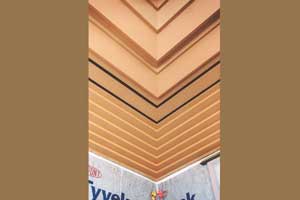 Cornice with secondary stain color added to alternating fascia pieces