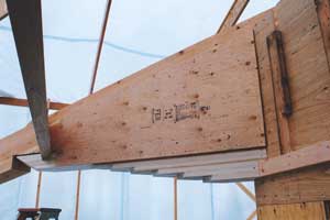 Adding diaphragm plywood overlay glued and nailed to both sides to give structural strength far beyond the specs