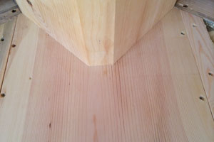 Scribed fit of vertical beam column to main ridge beam