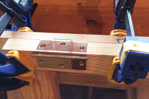 Merit solid brass hinge inserted in window sash edge rout