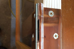 Precision Merit hinge screwed into window edge