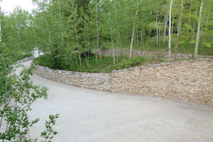 Lower driveway and parking separated by natural island
